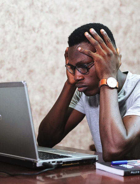 Frustrated man using computer
