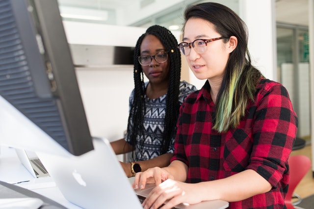 Photo of pair programmers by Christina Morillo from Pexels (https://www.pexels.com/photo/woman-wearing-red-and-black-checkered-blouse-using-macbook-1181472/)